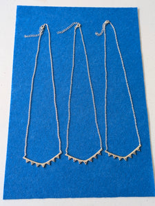 Indian silver curve and stone necklace