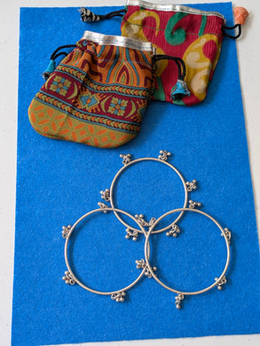 Solid Indian silver bangle with drop baubles charms