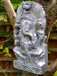 Hand-carved wooden Ganesh in silver